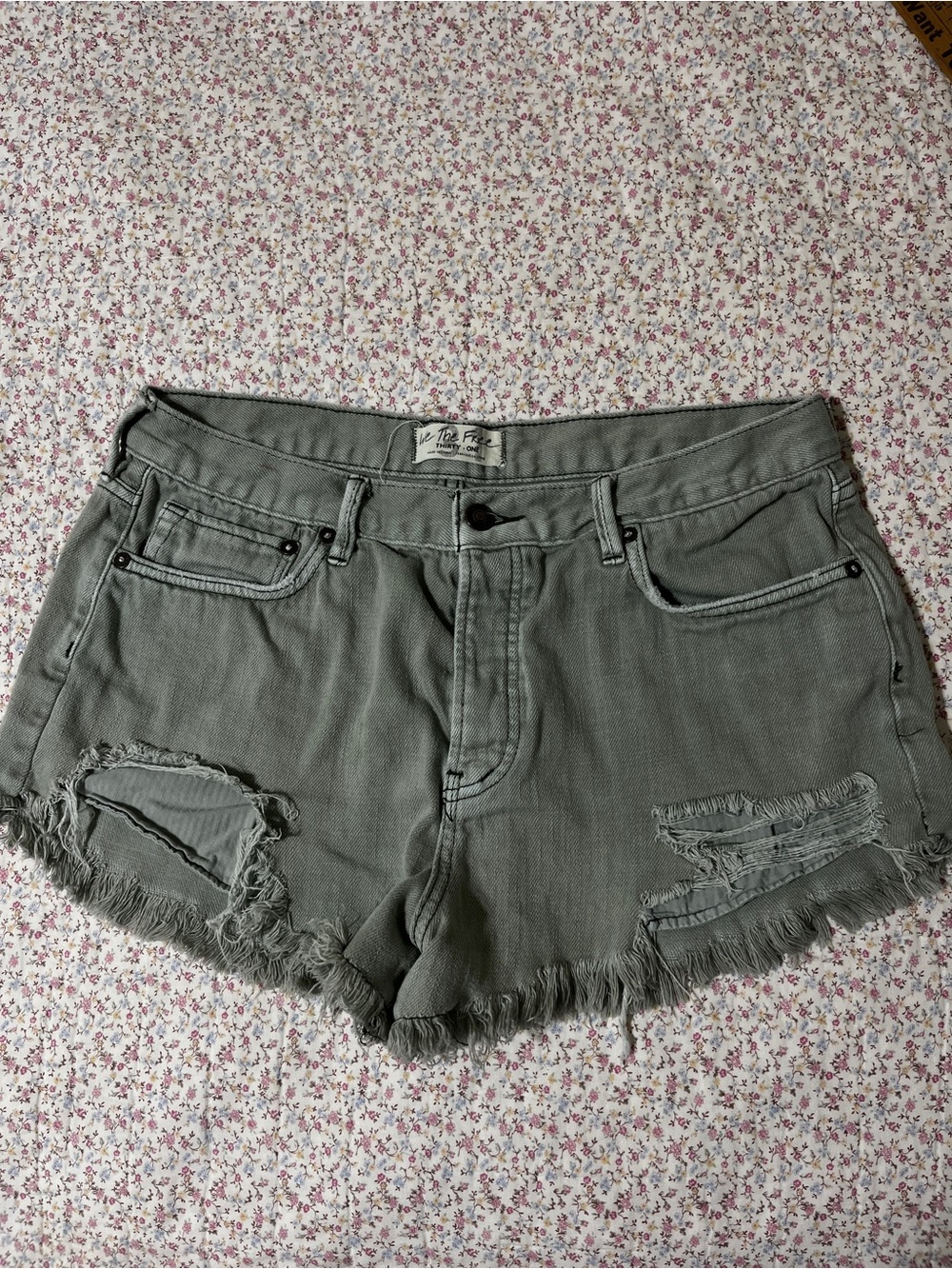 Free People Distressed High-Rise Jean Shorts in Sage Green. 31